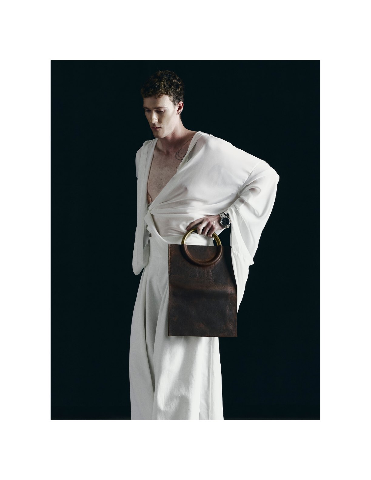 White suiting and leather accessory look